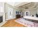 Expansive main bedroom with a fireplace, hardwood flooring, and a private balcony at 2770 Wooded Hills Walk, Marietta, GA 30062