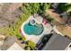 Aerial view of private pool and landscaped backyard featuring an outdoor lounge area and manicured greenery at 2770 Wooded Hills Walk, Marietta, GA 30062