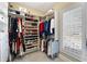 Spacious walk-in closet with custom shelving for clothes and shoes at 2770 Wooded Hills Walk, Marietta, GA 30062
