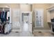Open doorway to the well-organized walk-in closet with shelving and ample space at 2770 Wooded Hills Walk, Marietta, GA 30062