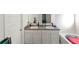 Bathroom with double sink vanity, white cabinets, tub, and white door at 294 Broder Farms Dr, Stockbridge, GA 30281