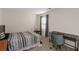 Bedroom featuring a bed, desk, and a window with curtains at 294 Broder Farms Dr, Stockbridge, GA 30281