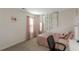 Bedroom featuring a bed, full length mirror, decorative vines and a window at 294 Broder Farms Dr, Stockbridge, GA 30281