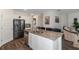 Modern kitchen with stainless steel appliances and an island with bar seating at 294 Broder Farms Dr, Stockbridge, GA 30281