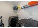 Laundry room with black washer and dryer and storage shelving at 294 Broder Farms Dr, Stockbridge, GA 30281