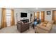Spacious living room with comfortable seating, TV, and hardwood floors at 294 Broder Farms Dr, Stockbridge, GA 30281