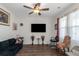 Cozy living room featuring modern ceiling fan and bright natural light at 294 Broder Farms Dr, Stockbridge, GA 30281