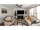 Open living room with elegant furnishings and a large television for entertainment at 294 Broder Farms Dr, Stockbridge, GA 30281