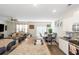 Spacious living area with open concept connecting the kitchen and dining spaces at 294 Broder Farms Dr, Stockbridge, GA 30281