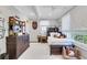 The bedroom features dark wood furniture and a football theme throughout the room at 11 Collier Nw Ln, Atlanta, GA 30305