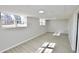 Bright basement space featuring ample natural light, updated flooring, and plenty of room at 2447 Old Peachtree Rd, Duluth, GA 30097