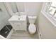 Well-lit bathroom with modern fixtures, including a toilet, shower, and vanity with storage at 2447 Old Peachtree Rd, Duluth, GA 30097