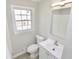 Cozy bathroom featuring a modern sink and updated vanity at 2447 Old Peachtree Rd, Duluth, GA 30097