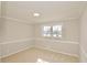 Comfortable bedroom features a flush mount light and soft carpet flooring at 2447 Old Peachtree Rd, Duluth, GA 30097
