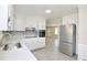 Updated kitchen with quartz countertops, stainless steel appliances and stylish backsplash at 2447 Old Peachtree Rd, Duluth, GA 30097