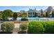 Inviting community pool surrounded by manicured landscaping and comfortable lounge seating at 303 Dexter Dr, Woodstock, GA 30188