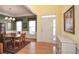 Open-concept space with hardwood flooring, leading to the formal dining and entry area at 303 Dexter Dr, Woodstock, GA 30188