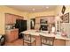 Eat-in kitchen featuring ample counter space, light wood cabinets, and modern appliances at 303 Dexter Dr, Woodstock, GA 30188