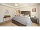 Cozy main bedroom with a decorative ceiling, wood furniture, and carpeted floors at 303 Dexter Dr, Woodstock, GA 30188