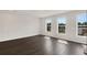 Bright bedroom with three large windows, hardwood floors, and neutral paint at 320 Mahone Dr, Lilburn, GA 30047