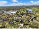 Stunning aerial view of a charming home nestled among trees, with the city skyline in the distance on a sunny day at 46 W Belle Isle Rd, Atlanta, GA 30342