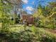 Backyard featuring a red brick home with a stone walkway at 46 W Belle Isle Rd, Atlanta, GA 30342