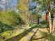Tranquil backyard featuring mature landscaping, greenery, and a peaceful outdoor space at 46 W Belle Isle Rd, Atlanta, GA 30342
