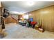 Basement living area with wood paneling and carpeting ready for finishing and customization at 46 W Belle Isle Rd, Atlanta, GA 30342
