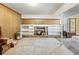 Spacious basement area with a fireplace, built-in shelves, and backyard access at 46 W Belle Isle Rd, Atlanta, GA 30342