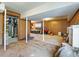 Open basement with wood paneling and carpeting ready for finishing and customization at 46 W Belle Isle Rd, Atlanta, GA 30342