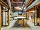 Unfinished basement with exposed ceiling, concrete walls, and shelving at 46 W Belle Isle Rd, Atlanta, GA 30342