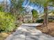 Long driveway leading up to a home featuring an attached carport in a lush setting at 46 W Belle Isle Rd, Atlanta, GA 30342