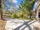 Long driveway leading to the home, surrounded by mature trees and landscaping at 46 W Belle Isle Rd, Atlanta, GA 30342