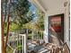 Charming front porch with a gray front door and views of the landscaped front yard at 46 W Belle Isle Rd, Atlanta, GA 30342