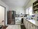 A clean kitchen with stainless steel refrigerator and white cabinetry at 46 W Belle Isle Rd, Atlanta, GA 30342