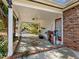 Spacious covered patio with white columns and brick base, offering outdoor living and storage space at 46 W Belle Isle Rd, Atlanta, GA 30342