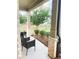 Covered porch features comfortable seating with a backyard view at 5745 Pickens Garden Ln, Powder Springs, GA 30127
