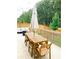 Spacious outdoor patio with a wooden table, chairs, and privacy fencing at 5745 Pickens Garden Ln, Powder Springs, GA 30127