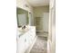 Bathroom featuring dual sinks, granite countertops, neutral paint and a walk-in shower at 5745 Pickens Garden Ln, Powder Springs, GA 30127