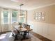 Bright dining room with large windows and modern decor at 5745 Pickens Garden Ln, Powder Springs, GA 30127