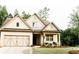 Beautiful home featuring a landscaped front yard and a spacious driveway at 5745 Pickens Garden Ln, Powder Springs, GA 30127