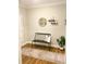 Hallway features a cozy bench and stylish decor at 5745 Pickens Garden Ln, Powder Springs, GA 30127