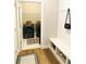 Convenient laundry room includes modern washer and dryer, and useful built-in bench with shoe storage at 5745 Pickens Garden Ln, Powder Springs, GA 30127