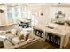 Bright living room with an open floor plan to dining and kitchen areas at 5745 Pickens Garden Ln, Powder Springs, GA 30127
