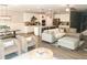 Open-concept living room featuring comfortable seating and a kitchen at 5745 Pickens Garden Ln, Powder Springs, GA 30127