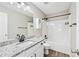 Bathroom featuring a vanity with a granite countertop, a sink, and a shower/tub combo at 2373 Shady Maple Ln, Loganville, GA 30052