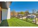 Spacious balcony with artificial turf and clear glass railing, offering neighborhood views under a clear sky at 548 Fletcher St, Atlanta, GA 30310