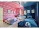 Unique bedroom with pink and blue color blocking, two twin beds, and stylish decor, perfect for or guests at 548 Fletcher St, Atlanta, GA 30310