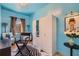 Stylish bedroom with blue walls, sleek white wardrobe, and cozy seating area near the window at 548 Fletcher St, Atlanta, GA 30310