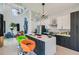 Bright kitchen showcasing high ceilings, white countertops, sleek appliances, and a cozy seating area in the background at 548 Fletcher St, Atlanta, GA 30310
